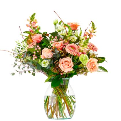 A vase of mixed pastel flowers including pink roses, carnations, and greenery in water-filled glass vase.