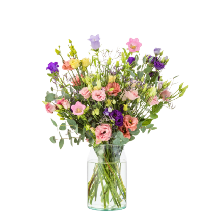 Colorful mixed bouquet in a clear glass vase, with pink, peach, yellow, and purple flowers and green foliage.