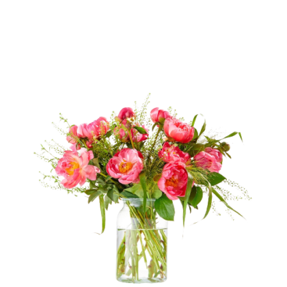 Pink bouquet with lush greenery in a clear glass vase against a white background, arranged as a centerpiece