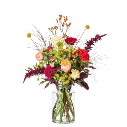 Colorful bouquet of roses, carnations, and assorted flowers in a clear glass vase.