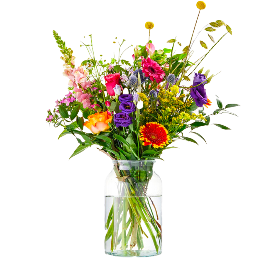 Colorful bouquet of mixed flowers in a clear glass vase with water.
