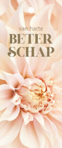 Close-up pale peach flower with the words 'van harte BETER SCHAP' on a greeting card, conveying get-well wishes.